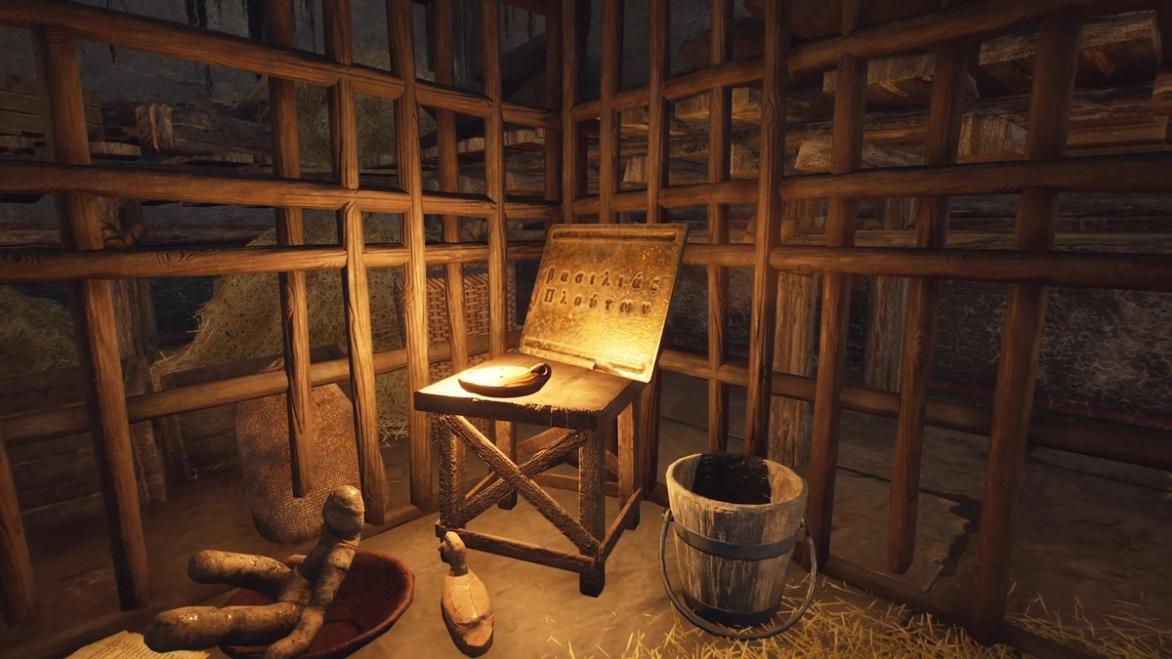 The Forgotten City. The greek plaque is in the back lefthand corner of Duli's cell. It is on a wooden table. There is a bucket to the right of the table. There is a wooden duck and soft toy in a bowl in front of the table.